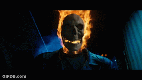 A Skeleton With Flames Coming Out Of It 'S Head GIF