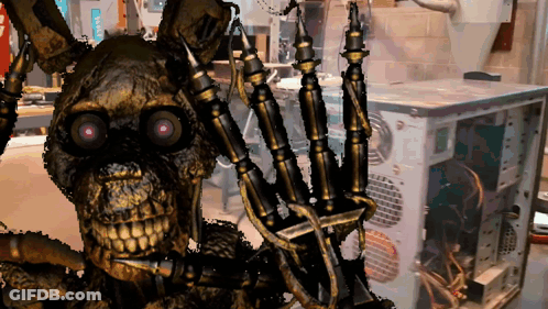 A Skeleton With Purple Eyes Is Standing In Front Of A Computer Monitor GIF