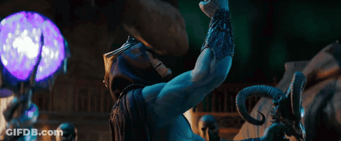 A Skeletor Statue With Horns And A Purple Light In The Background GIF