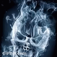 A Skull Is Surrounded By Smoke And Flames On A Black Background . GIF