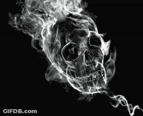 A Skull Is Surrounded By Smoke On A Black Background . GIF