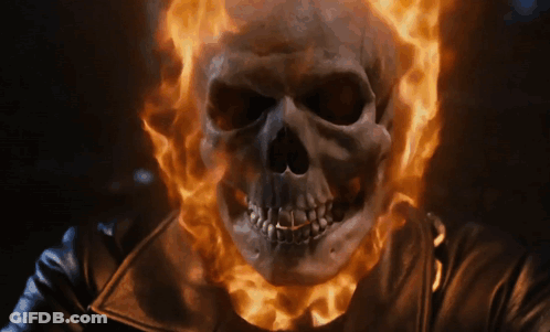 A Skull With Flames Coming Out Of It GIF