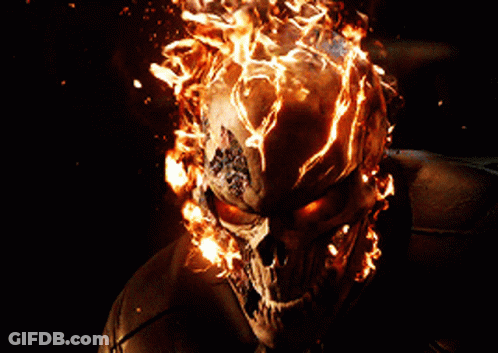 A Skull With Flames Coming Out Of It 'S Head GIF