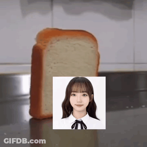 A Slice Of Bread With A Picture Of A Girl On It GIF