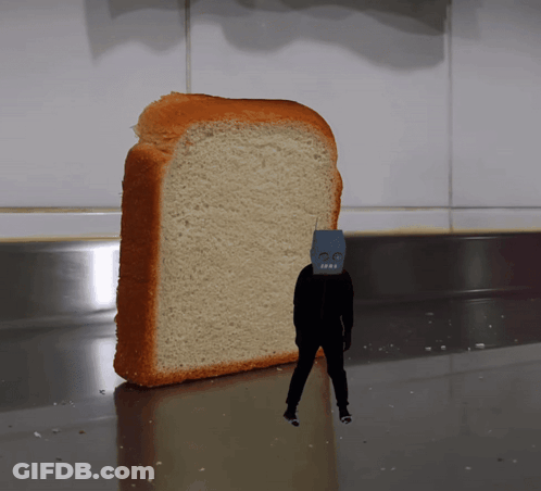 A Slice Of Bread With A Robot Face On It GIF