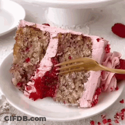 A Slice Of Cake With Pink Frosting And Strawberry Sauce On A Plate With A Fork . GIF