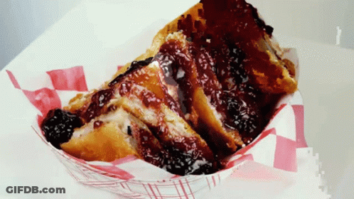 A Slice Of French Toast With A Berry Sauce On Top GIF