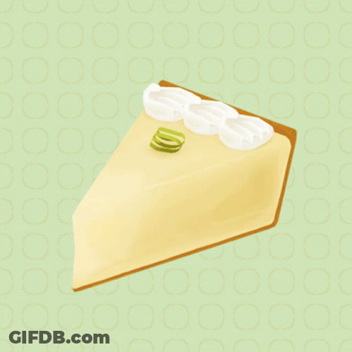 A Slice Of Key Lime Pie With Whipped Cream And Lime Zest On Top GIF