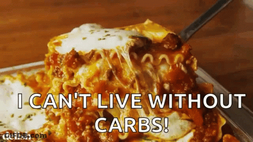 A Slice Of Lasagna Is Being Eaten With The Words " I Can 'T Live Without Carbs " Above It GIF