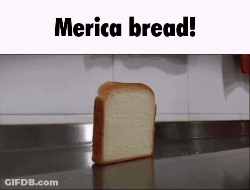 A Slice Of Merica Bread Is Sitting On A Counter Top GIF