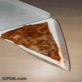 A Slice Of Pizza Is In A Cardboard Box On A Table GIF