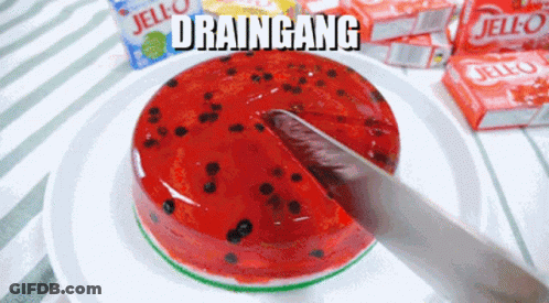 A Slice Of Watermelon Jello Is Being Taken Out Of It GIF