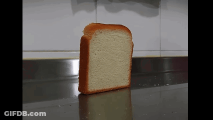 A Slice Of White Bread Is Sitting On A Counter GIF