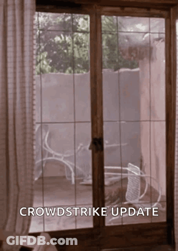 A Sliding Glass Door With The Words Crowdstrike Update On The Bottom GIF