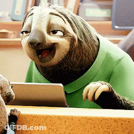 A Sloth Is Wearing A Green Shirt And Smiling While Looking At A Tablet GIF