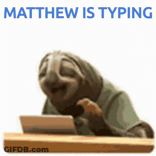 A Sloth Sitting At A Desk With The Words Matthew Is Typing Above It GIF