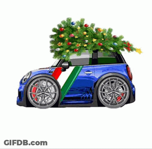 A Small Blue Car With A Christmas Tree On Top Of It GIF