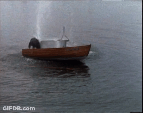 A Small Boat Is Floating On A Body Of Water And Has The Name ' Amanda ' On The Side GIF