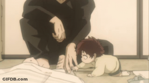 A Small Child Is Crawling On The Floor Next To A Man GIF
