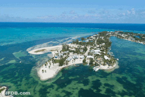 A Small Island In The Middle Of A Body Of Water GIF