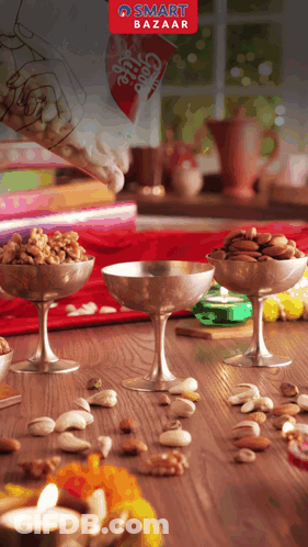 A Smart Bazaar Advertisement Shows A Person Pouring Nuts Into Bowls GIF