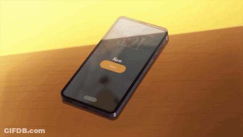 A Smart Phone Displays An Alarm Clock On Its Screen GIF