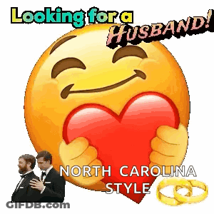 A Smiley Face Holding A Heart With The Words Looking For A Husband GIF