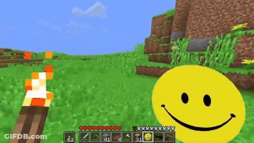 A Smiley Face In A Video Game With A Torch In The Background GIF