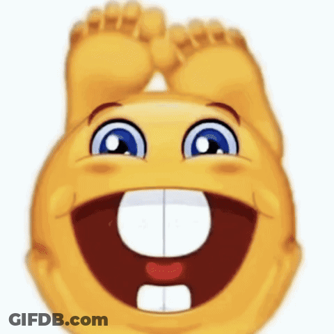 A Smiley Face Is Laughing With Its Feet Up And A Big Smile On Its Face . GIF
