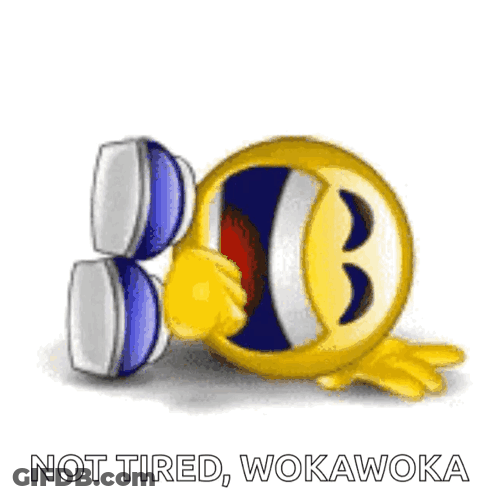 A Smiley Face Is Laughing With The Words " Not Tired Wokawoka " Written Below It GIF