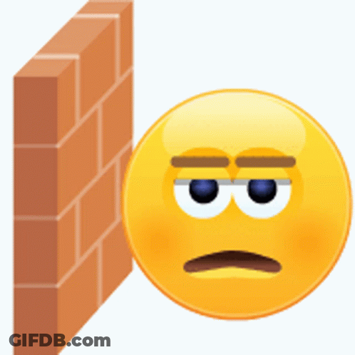 A Smiley Face Leaning Against A Brick Wall With A Sad Look On Its Face GIF