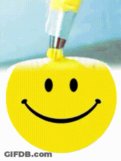 A Smiley Face With A Toothbrush In It GIF