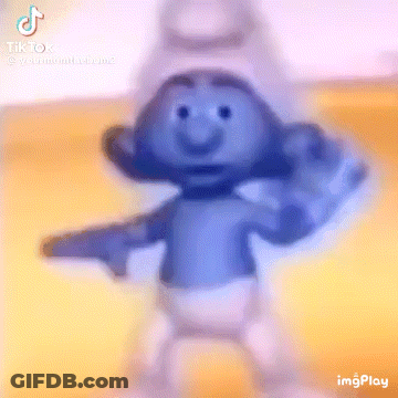 A Smurf Is Dancing And Pointing At The Camera With A Gun . GIF