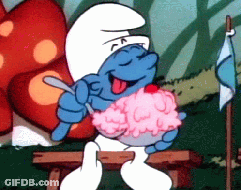 A Smurf Sitting On A Bench Eating Ice Cream With A Cherry On Top GIF