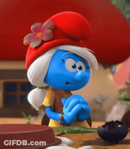 A Smurf Wearing A Red Hat And A Yellow Shirt GIF