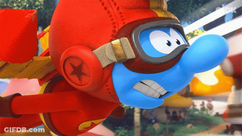 A Smurf Wearing A Red Helmet And Goggles Flies Through The Air GIF