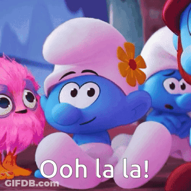 A Smurf With A Flower In His Hat Is Sitting Next To Another Smurf GIF