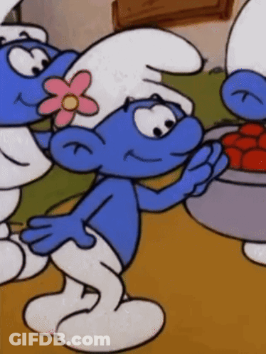 A Smurf With A Pink Flower On His Head Holds A Bowl Of Tomatoes GIF