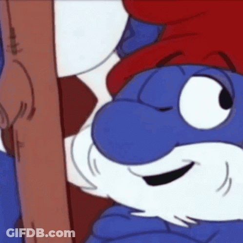 A Smurf With A Red Hat And Beard Is Holding A Wooden Stick . GIF