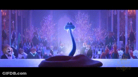 A Snake With A Long Neck Is Standing In Front Of A Crowd Of People At A Party . GIF