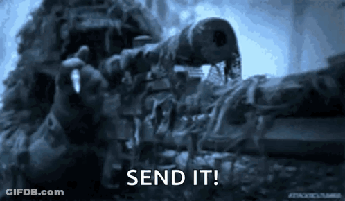 A Sniper Is Holding A Rifle In His Hand And Says Send It . GIF