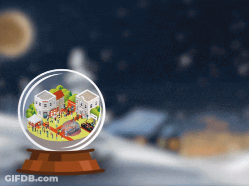 A Snow Globe With A Small Town Inside GIF
