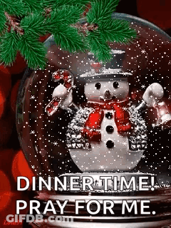 A Snow Globe With A Snowman Inside Of It And The Words `` Dinnertime ! Pray For Me . '' GIF