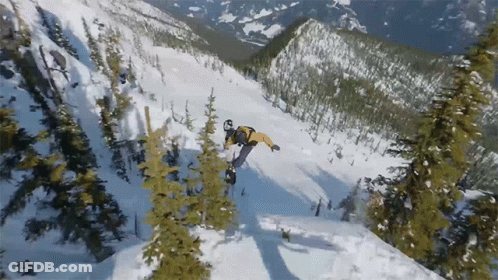 A Snowboarder In A Yellow Jacket Is Doing A Trick In The Snow GIF