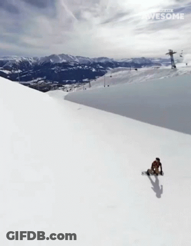 A Snowboarder Is Doing A Trick On A Snowy Slope And The Words Awesome Are Visible GIF