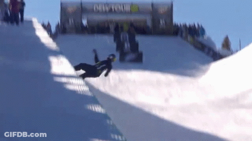 A Snowboarder Is Doing A Trick On A Snowy Slope In Front Of A Sign That Says Dew Tour GIF
