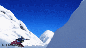 A Snowboarder Is Jumping Off A Snow Covered Cliff GIF