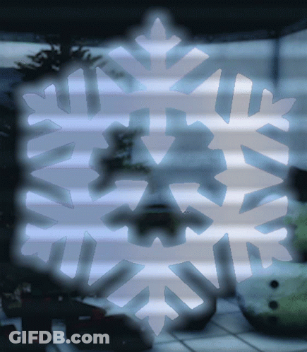 A Snowflake Is Visible In A Dark Room GIF