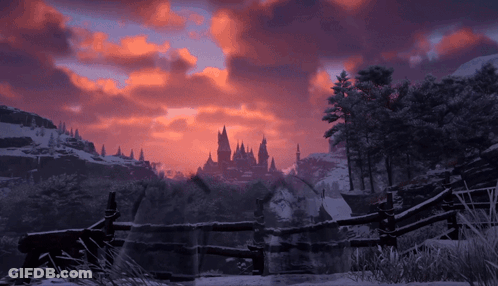 A Snowy Landscape With A Castle In The Distance At Sunset GIF