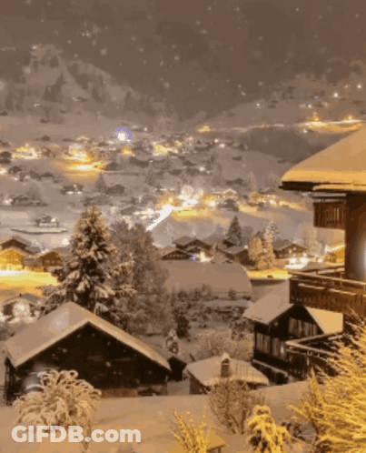 A Snowy Landscape With A House In The Foreground That Says ' A ' On It GIF